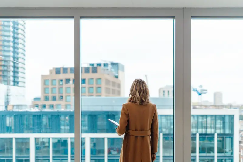 Woman staring out of window